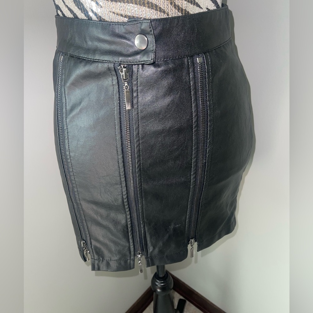 Carmin size small, pleather mini.